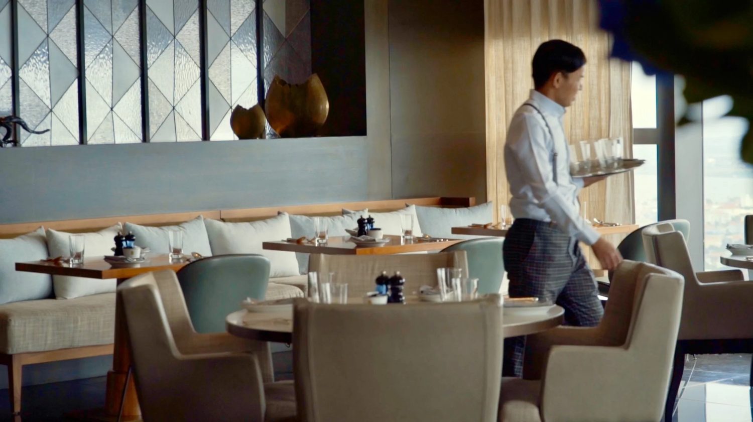 A course carried across the dining room
