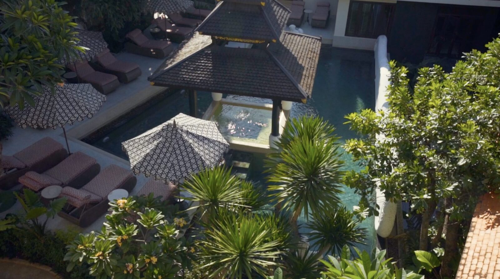 Puripunn Hideaway's courtyard pool and Lanna rooftops from above