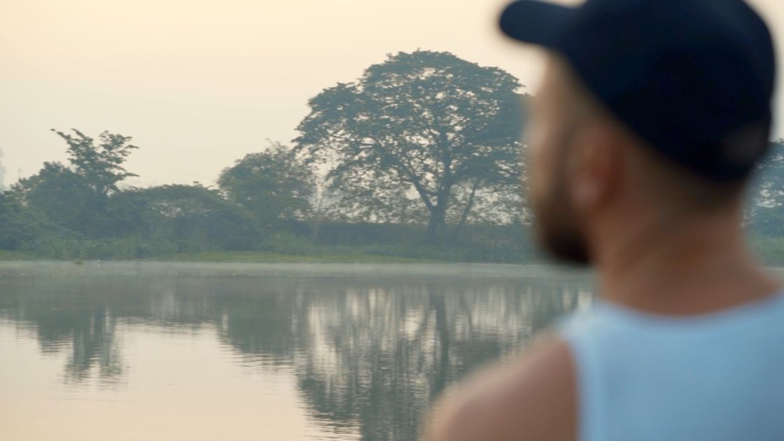 A guest takes in the morning river