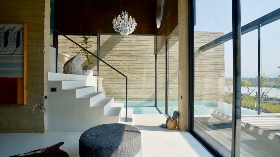 A villa interior open to the water