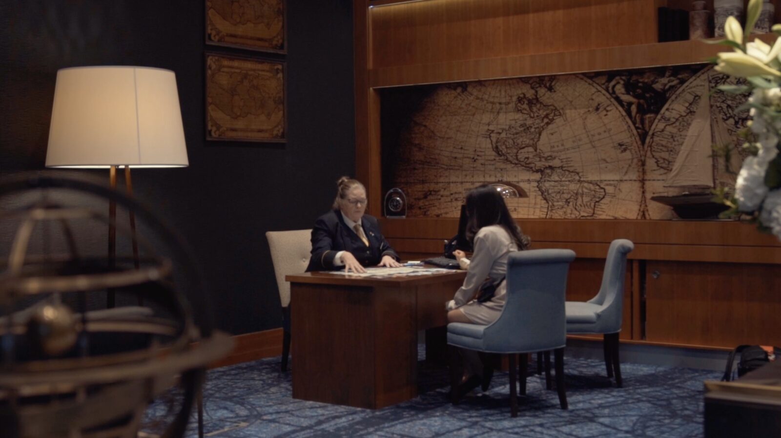 The concierge desk beneath the map