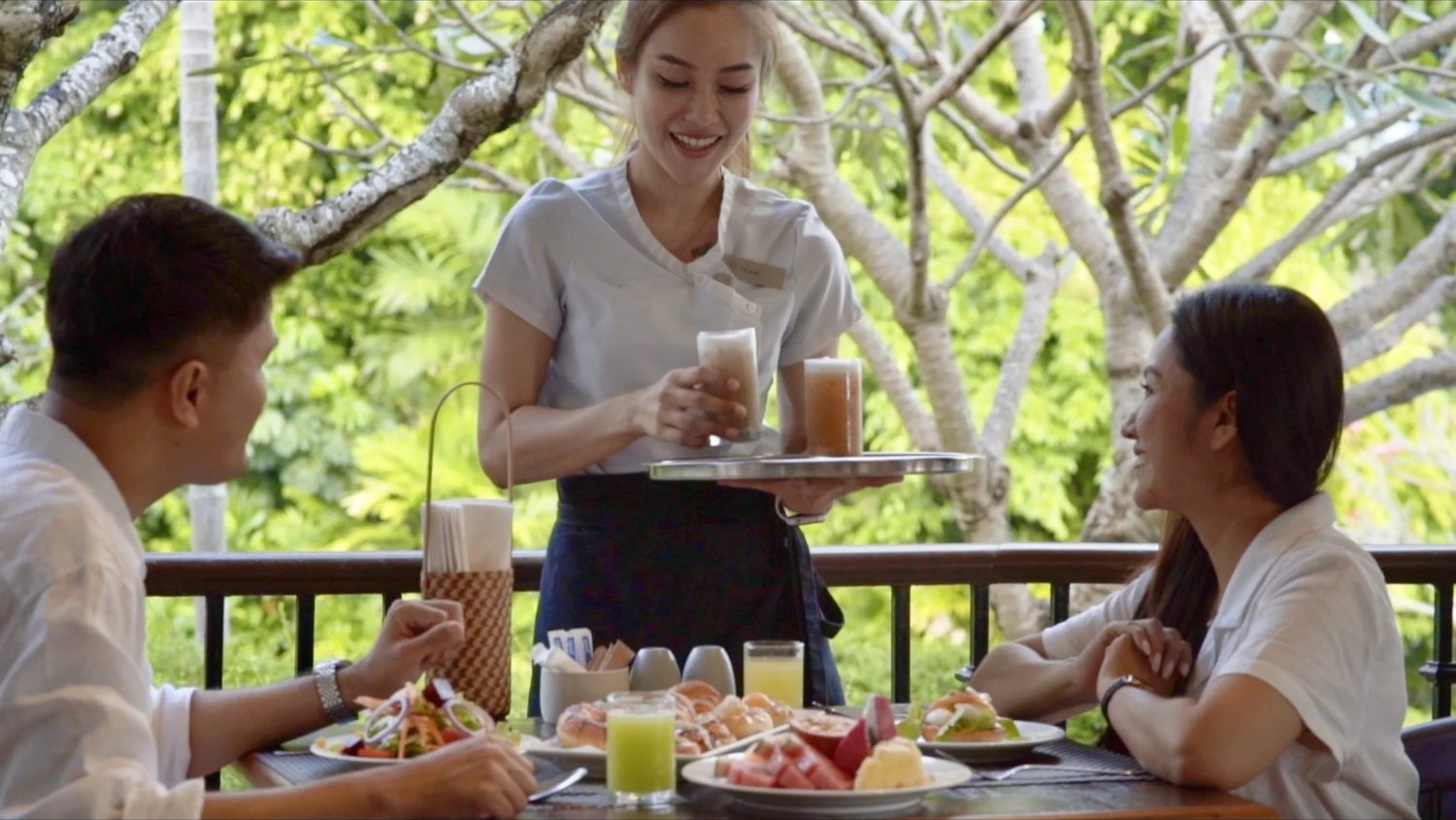 Breakfast brought to the table on the terrace